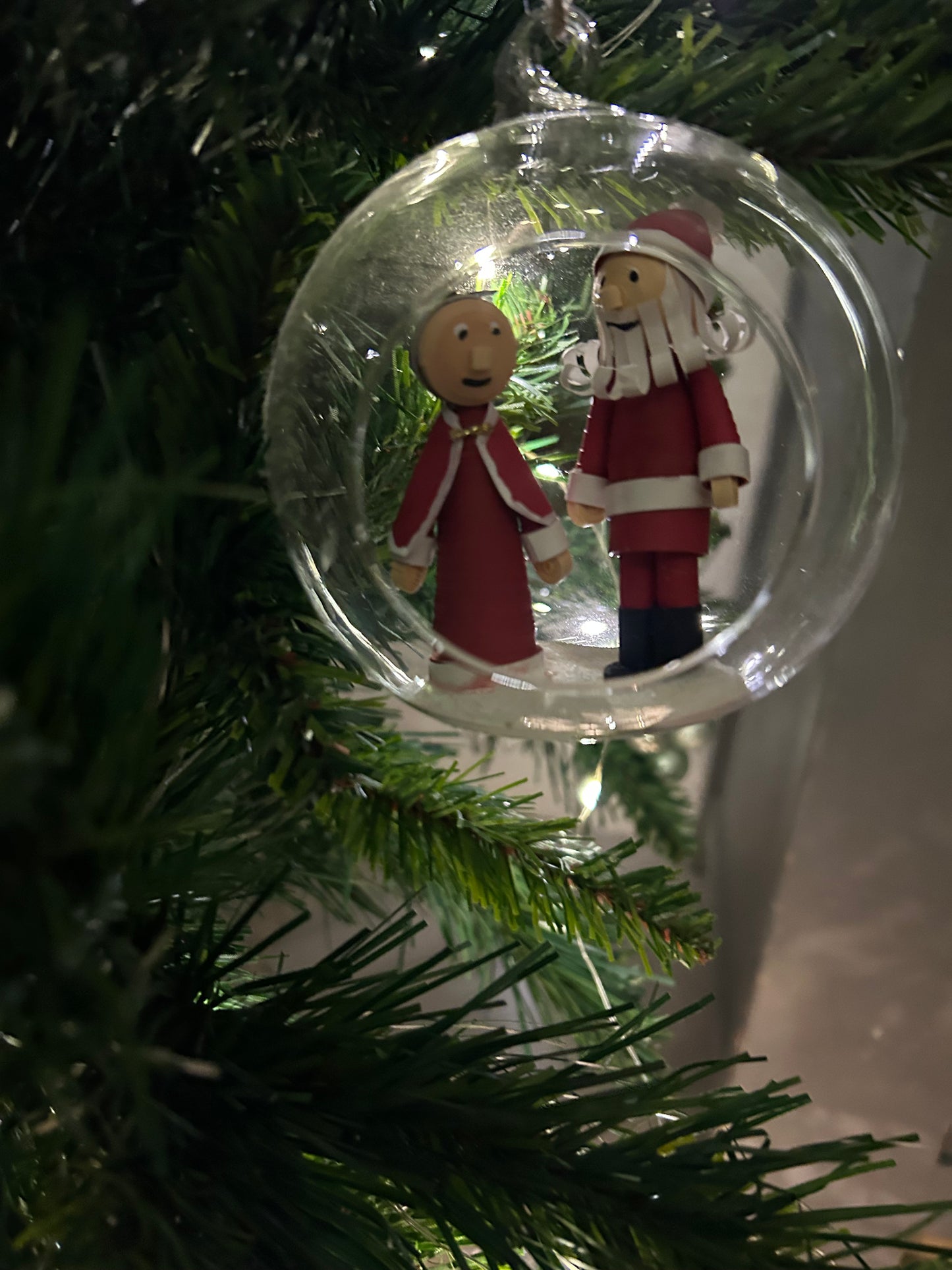 Santa and Mrs Claus walking in the snow