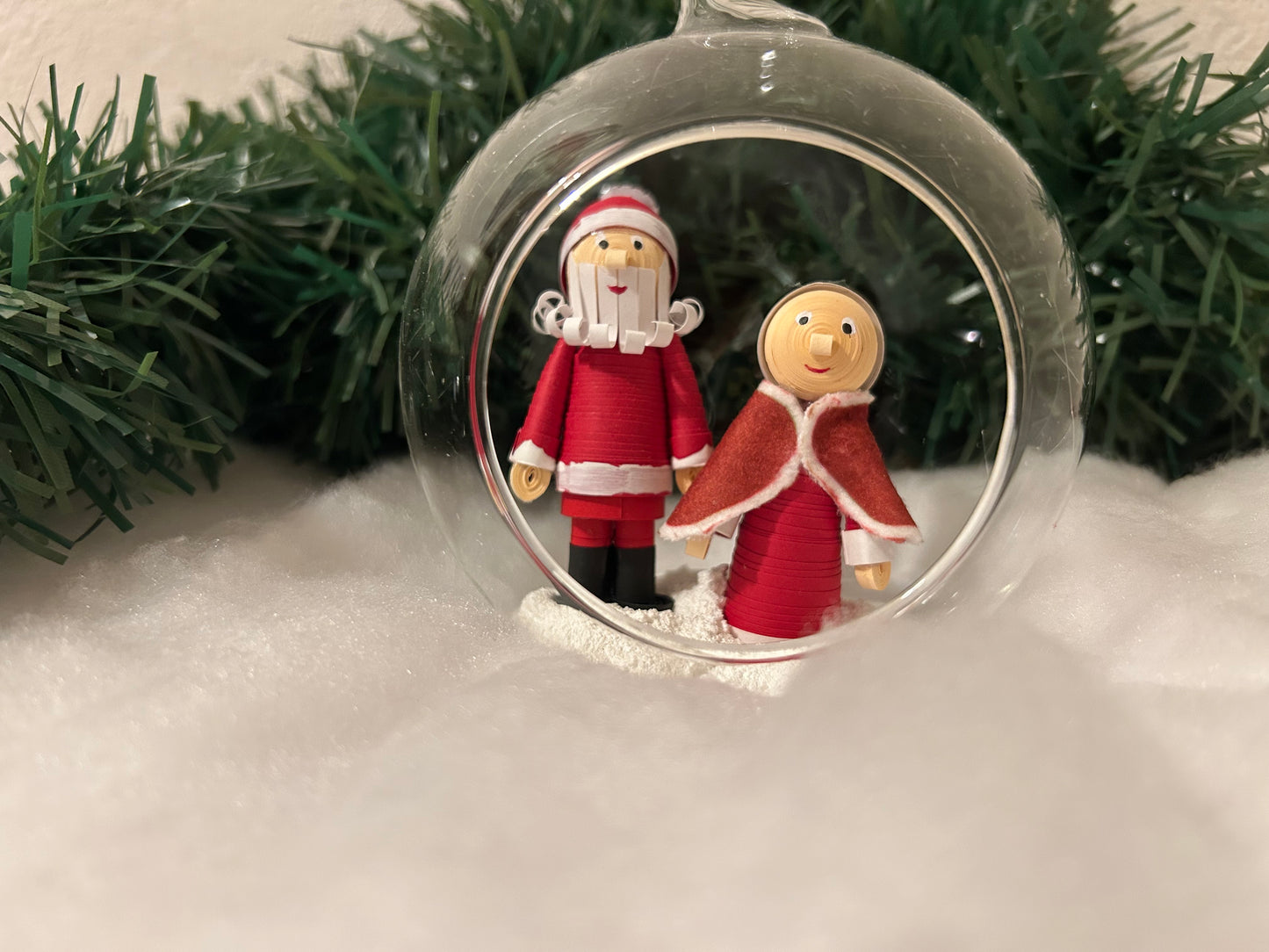 Santa and Mrs Claus walking in the snow