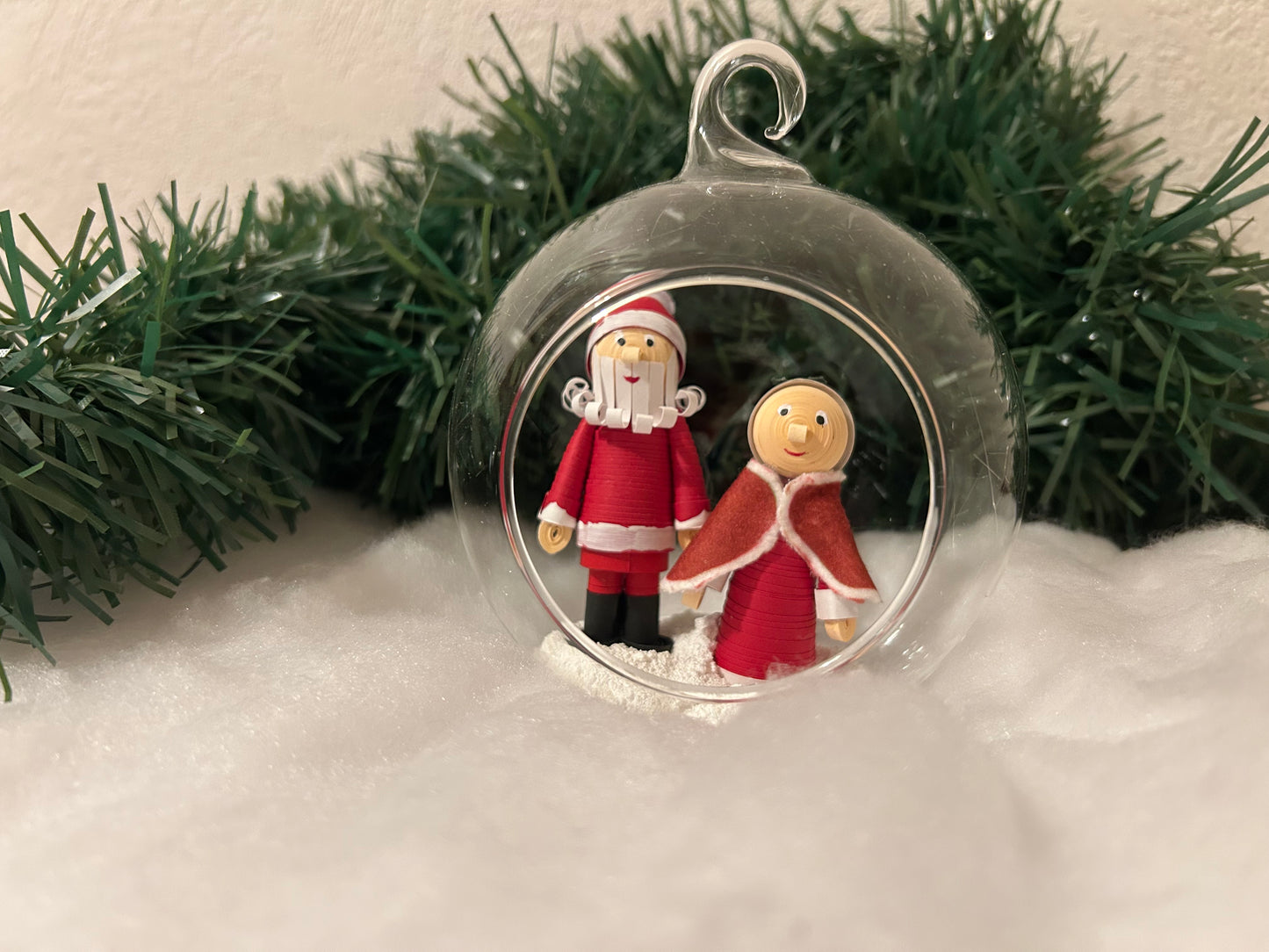 Santa and Mrs Claus walking in the snow