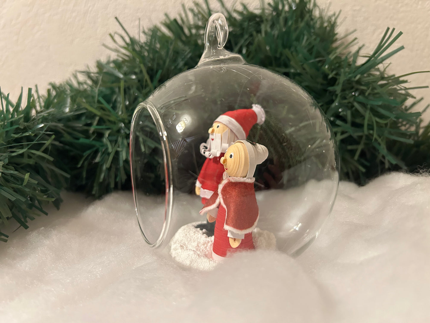 Santa and Mrs Claus walking in the snow